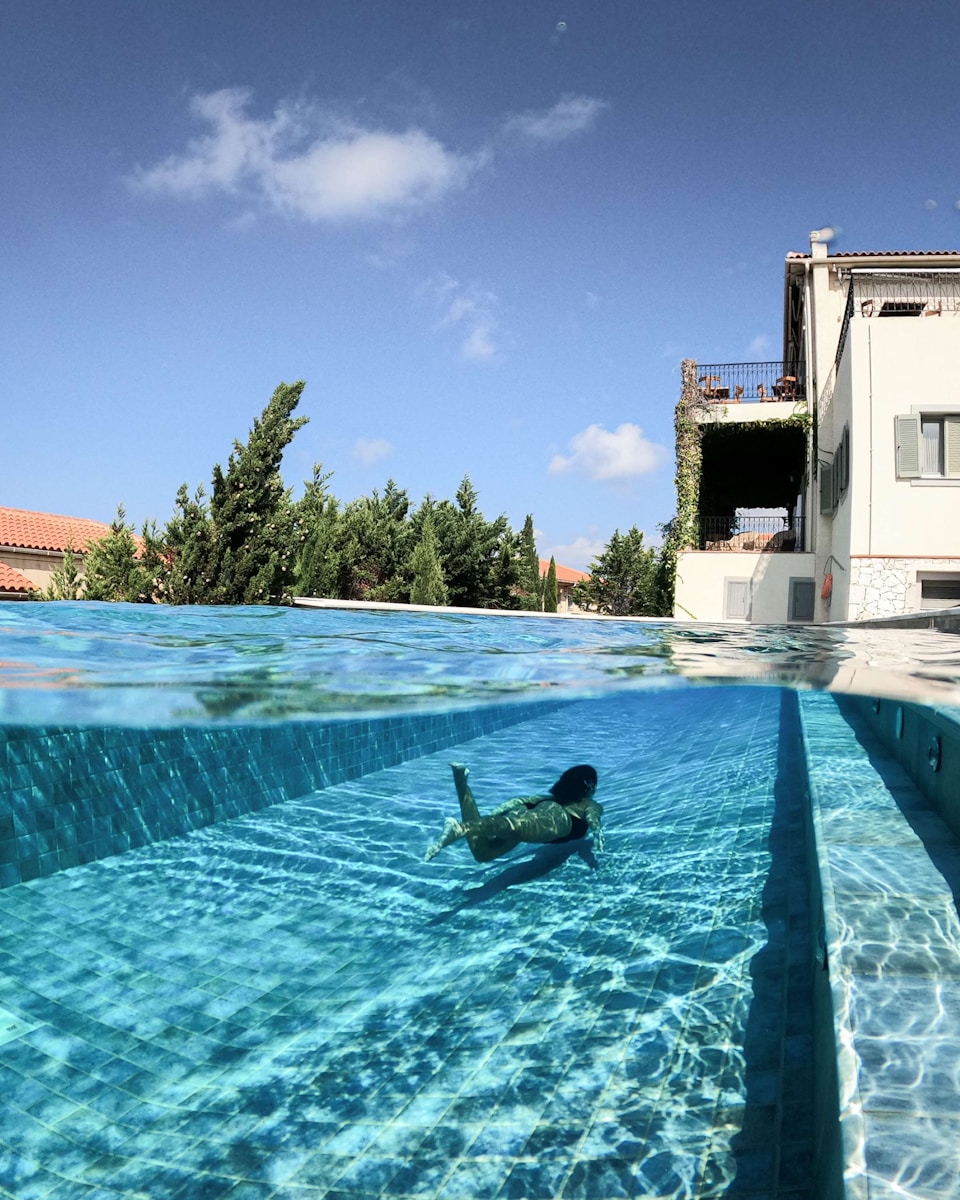 man in swimming pool during daytime uk pool
